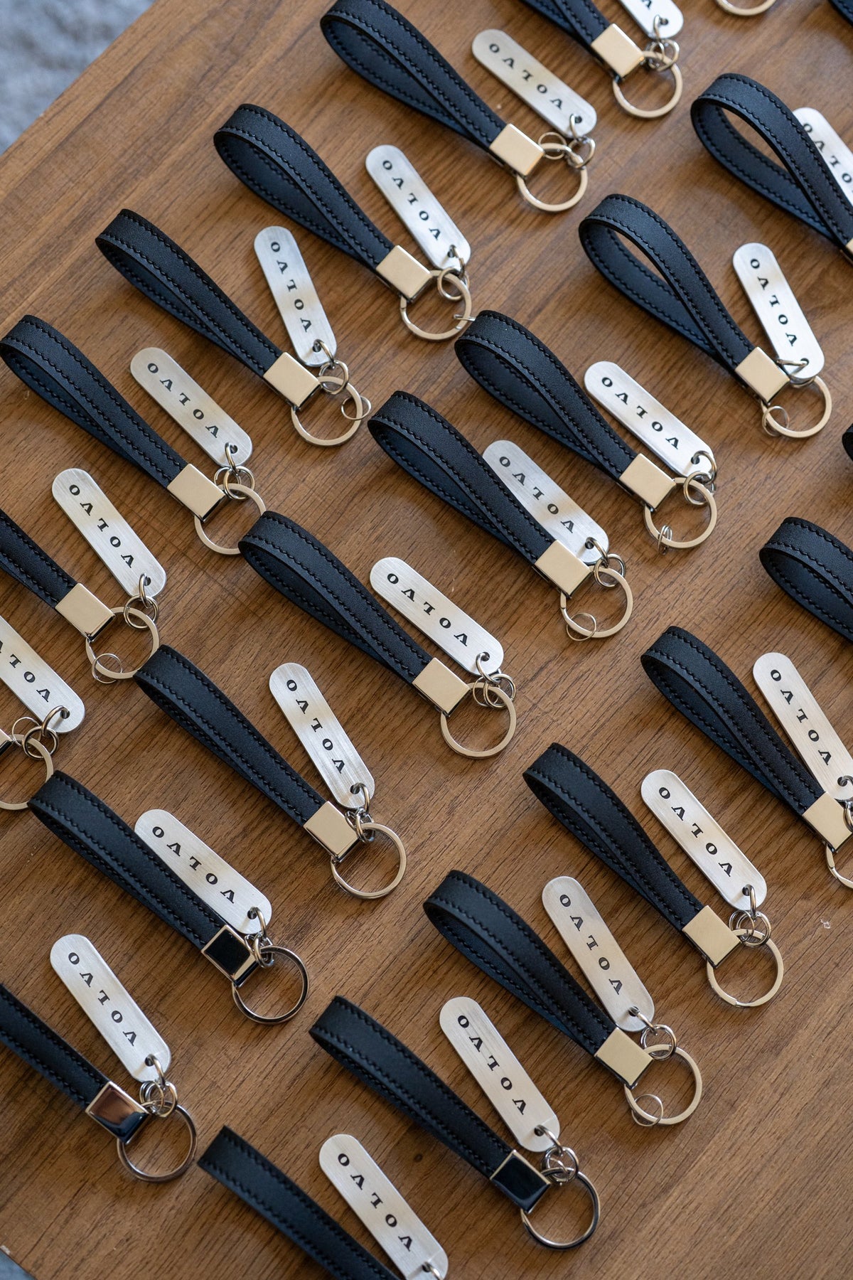 Handmade leather keychains made from Volvo interior leather for a Volvo brand activation – Impossible Leather, Toronto